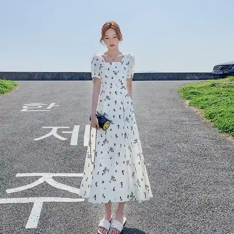White Floral Print Ruffle Dress for Women Dubai UAE elegant women's floral dress with ruffle design for casual outings parties and summer fashion