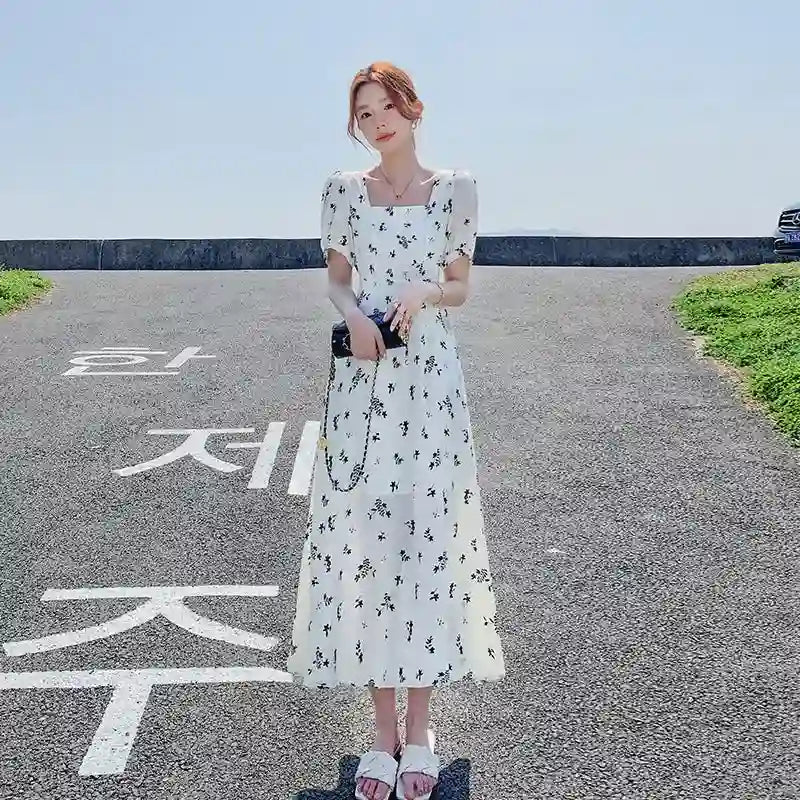 White Floral Print Ruffle Dress for Women Dubai UAE elegant women's floral dress with ruffle design for casual outings parties and summer fashion