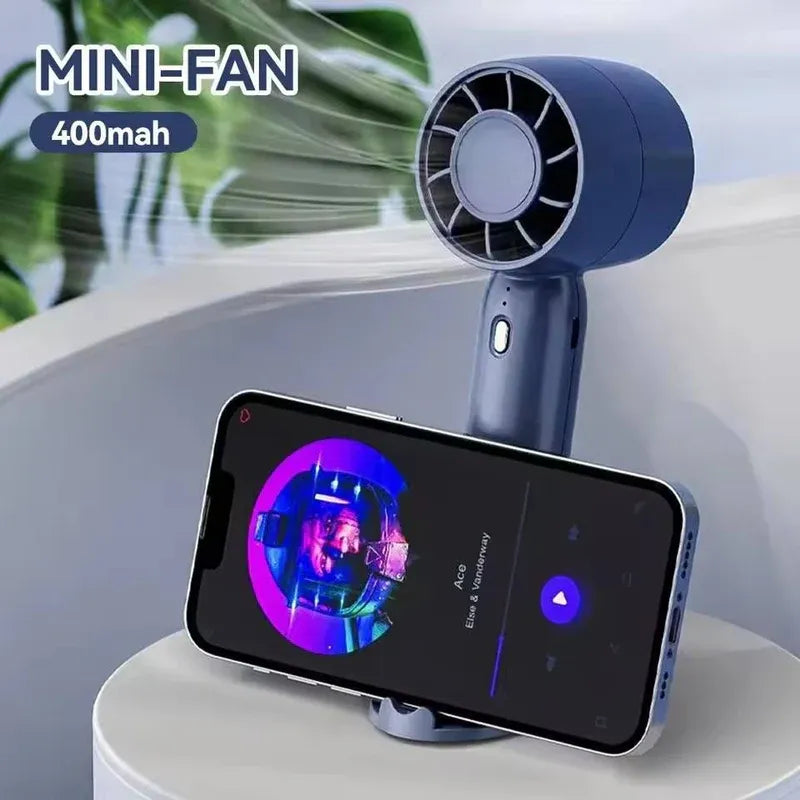Portable Handheld Mini Fan with Phone Holder Dubai UAE rechargeable mini fan with built in phone holder for travel office home and outdoor use